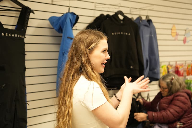 Store staff assisting customer